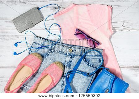 Female casual summer clothing collection overhead - clothes and electronics