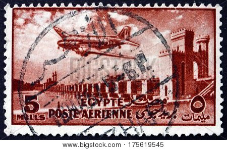 EGYPT - CIRCA 1953: a stamp printed in Egypt shows Delta Dam and DC-3 Plane circa 1953