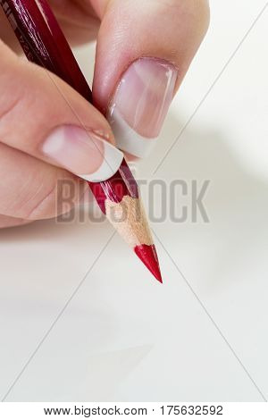 hand with red pencil