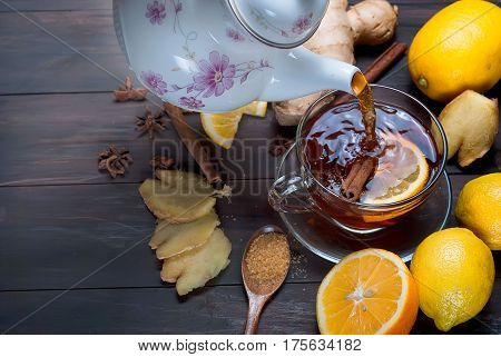 Cup Of Ginger Tea With Lemon And Honey On Dark Brown Wooden  Background