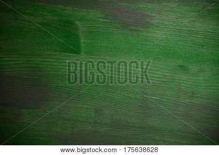 Green wood texture. Green wood background. Close up view of green wood texture and background. Abstract background and texture for designers. Rustic table. Texture of handmade green table.
