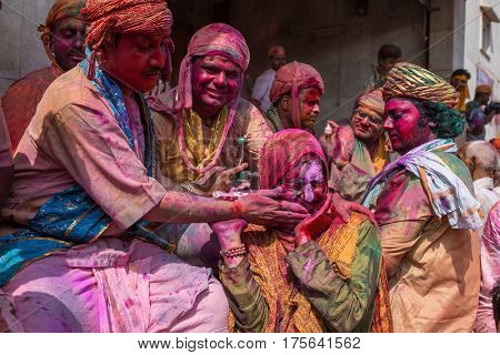 Nandgaon, India - March 17, 2016: Devotees celebrate Lathmar Holi in Nandgaon village, Uttar Pradesh, India.