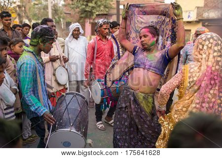 Barsana, India - March 17, 2016: Devotees celebrate Lathmar Holi in Barsana village, Uttar Pradesh, India.