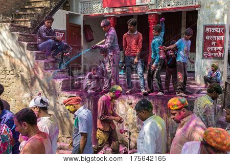 Barsana, India - March 17, 2016: Kids celebrate Lathmar Holi in Barsana village, Uttar Pradesh, India.