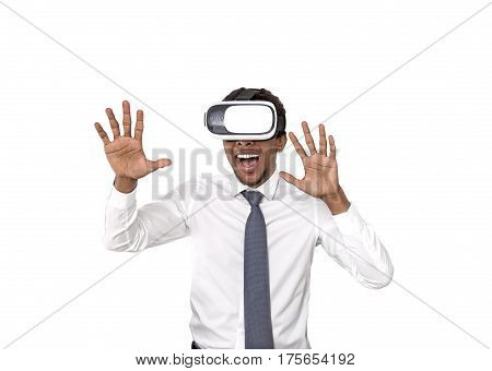 Isolated portrait of an African American businessman wearing vr glasses. He is enjoying a game and likes what he is seeing.