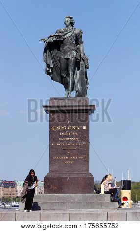Stockholm Sweden - May 9 2016: The statue of the Swedish king Gustaf III:by Johan Tobias Sergel located at Skeppsbrokajen near the royal palace.