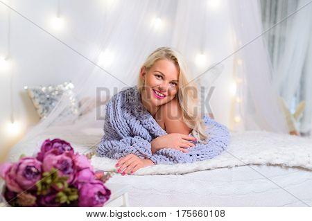 blonde in Lace Pullover Sweater looking at the camera