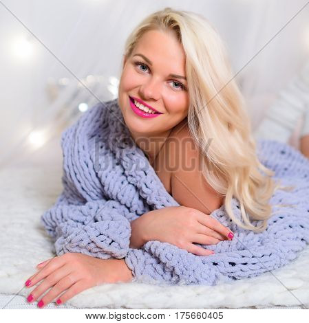 blonde in Lace Pullover Sweater looking at the camera
