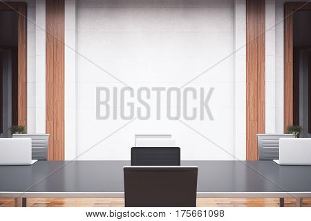 Front view of modern meeting room with furniture and empty conrete wall. Mock up 3D Rendering