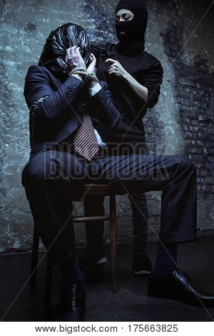 You wanna play. Senseless violent fierce captor trying scaring a man whom she keeping hostage while pointing a gun at him