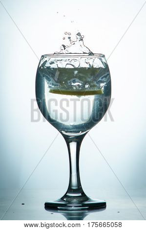 Slice Of Lemon Drops In A Glass Of Water