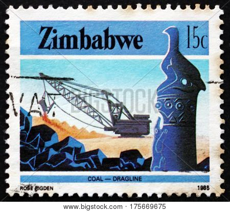 ZIMBABWE - CIRCA 1985: a stamp printed in Zimbabwe shows Zimbabwe bird and coal mining industry circa 1985