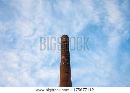 Red brick chimney from an abandoned factory dating back from the industrial revolution