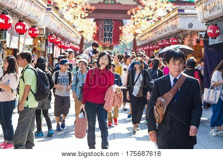 TOKYO JAPAN-October 20: Crowded people heading to the Buddhist Temple Sensoji on October 20 2016 in Tokyo Japan. The Sensoji temple in Asakusa area is the oldest temple in Tokyo.