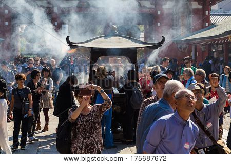 TOKYO JAPAN-October 20: Crowded people heading to the Buddhist Temple Sensoji on October 20 2016 in Tokyo Japan. The Sensoji temple in Asakusa area is the oldest temple in Tokyo.