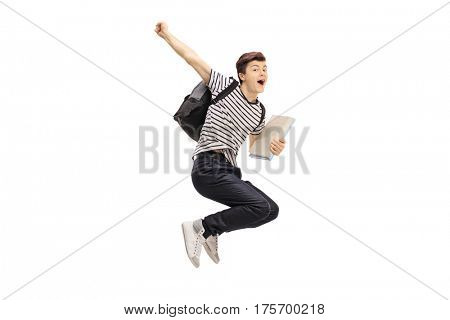 Overjoyed teenage student jumping and gesturing happiness isolated on white background