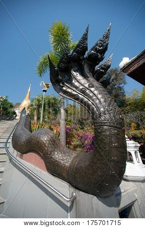 UDON THANI,THAILAND - JAN 25,2014: Image of Thai art of 7 heads Serpent on staircase to Chedi Prathom Rattanamahaburaphachan.The Chedi in Sri Lanka style,in Wat Pa Phu Kon of Na yung in Udon Thani Province,Thailand.