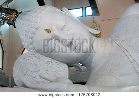 UDON THANI,THAILAND-JANUARY 25,2014 : The 20-meter long reclining Buddha, which is made from 43 blocks of exquisite Italian Carrara Marble, in Wat Pa Phu Kon of, Ban Na Kham, Ban Kong sub-district , Na yung District in Udon Thani Province, Thailand.