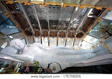 UDON THANI,THAILAND-JANUARY 25,2014 : The 20-meter long reclining Buddha, which is made from 43 blocks of exquisite Italian Carrara Marble, in Wat Pa Phu Kon of, Ban Na Kham, Ban Kong sub-district , Na yung District in Udon Thani Province, Thailand.