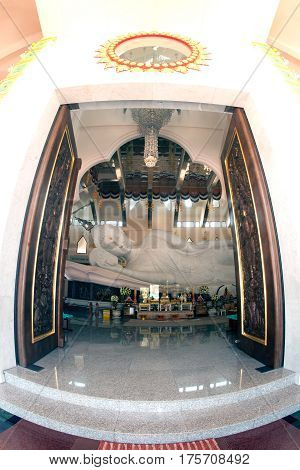 UDON THANI,THAILAND-JANUARY 25,2014 : The 20-meter long reclining Buddha, which is made from 43 blocks of exquisite Italian Carrara Marble, in Wat Pa Phu Kon of, Ban Na Kham, Ban Kong sub-district , Na yung District in Udon Thani Province, Thailand.