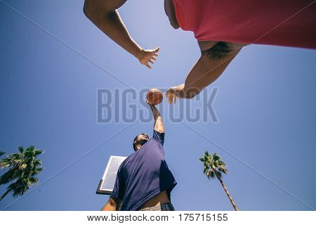 Friends playing basketball - Afro-american players having a friendly match outdoors