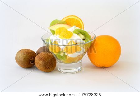 Dessert - fruit with cream, kiwi, apple and orange