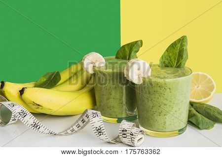Fresh and healthy green smoothie with spinach,banana and lemon
