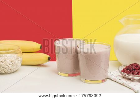 Useful banana smoothie with oatmeal and raspberry berries. Bright and healthy breakfast