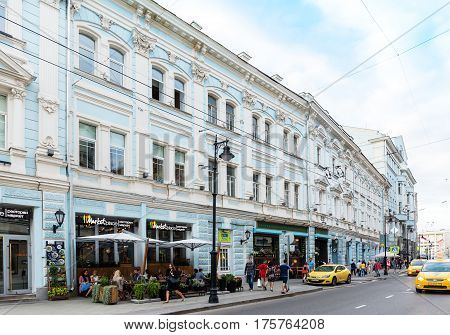MOSCOW - AUGUST 26 2016: People and taxi cars on Myasnitskaya street with the view of Spiridonov former revenue house and summer cafe. This area is known from 1482.