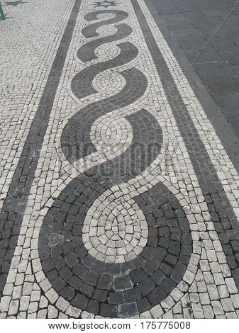 Typical Portuguese black and white stone mosaic 