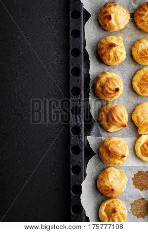 Baked Profiteroles On Tray Ready For Croquembouche. Top View. Copy Space
