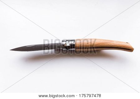 The mechanism of the folding knife. Gray background.