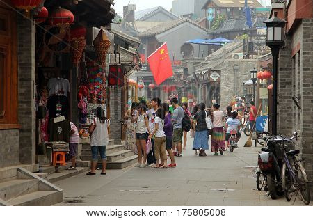 Beijing, China - Jul 4, 2011: Tourists Walking At Yandan (pipe) Hutong. This Ancient Street Is Very