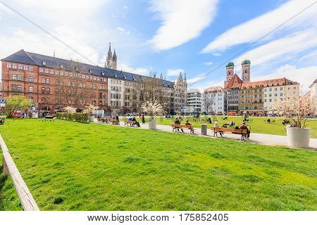 MUNICH BAVARIA GERMANY - APRIL 06 2016: People are walking though a shopping street towards Marienhof in Munich at the Evening Germany