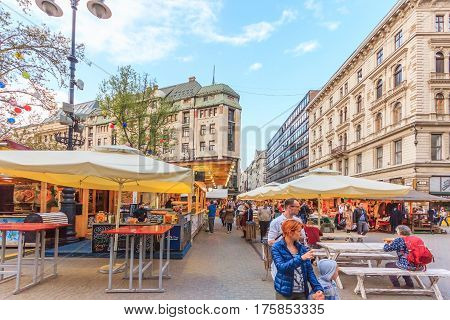 BUDAPEST HUNGARY - APRIL 13 2016: Tourists and visitors on Vaci Utca street the main pedestrian thoroughfares and perhaps the most famous street of central Budapest on April 13 2016. Budapest