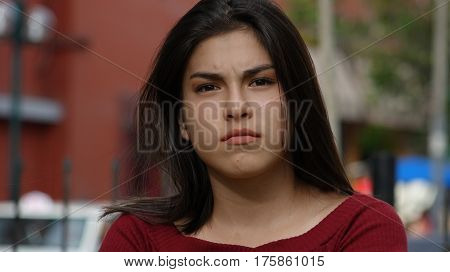 Serious and Unemotional Hispanic Young Teen Girl