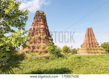 Two old historic brick towers near the Bagaya monastery at the ancient capital called Inwa or Ava near Mandalay in Burma