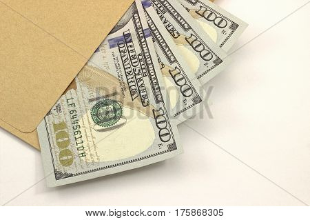 New Hundred Dollar Bills And Envelope On White Backgruond.