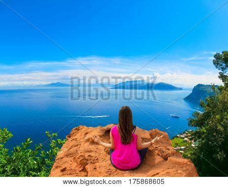 Young woman meditating outdoors at The beautiful Capri island. Collage