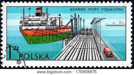 UKRAINE - CIRCA 2017: A stamp printed in POLAND shows Port in Harbour Gdansk series Polish Harbours circa 1976
