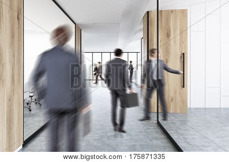 Rear view of businesmen in suits walking in an office corridor with wood and glass decoration elements. 3d rendering
