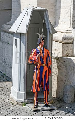 Rome, Italy July 7, 2013. Swiss Guard Defends The Basillica San Pietro.