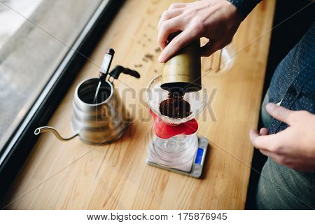 Picthers coffee and hands on the desk near window Dailight