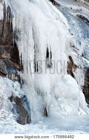icicles from ice on frozen on the mountain wall