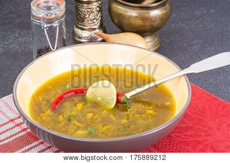 Spicy onion Indian soup with curry. Studio Photo