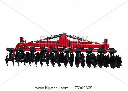 Tractor disc Harrow for preparing the ground. Isolated.  Disc Harrow is mainly applied in breaking up the clods, preparing the ground for planting, loosening the soil, mixing the soil with the fertilizer and cutting the stubble in light soil.