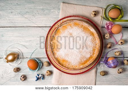 German Easter cake on a ceramic dish and eggs horizontal