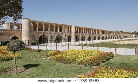 ISFAHAN, IRAN - OCTOBER 11, 2016: Si-o-se bridge crossing parched Zayandehrud river on October 11, 2016 in Isfahan, Iran