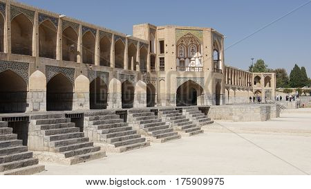 ISFAHAN, IRAN - OCTOBER 11, 2016: Khaju bridge crossing parched Zayandehrud river on October 11, 2016 in Isfahan, Iran