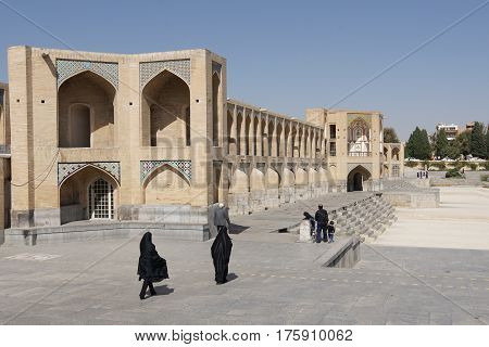 ISFAHAN, IRAN - OCTOBER 11, 2016: Khaju bridge crossing parched Zayandehrud river on October 11, 2016 in Isfahan, Iran